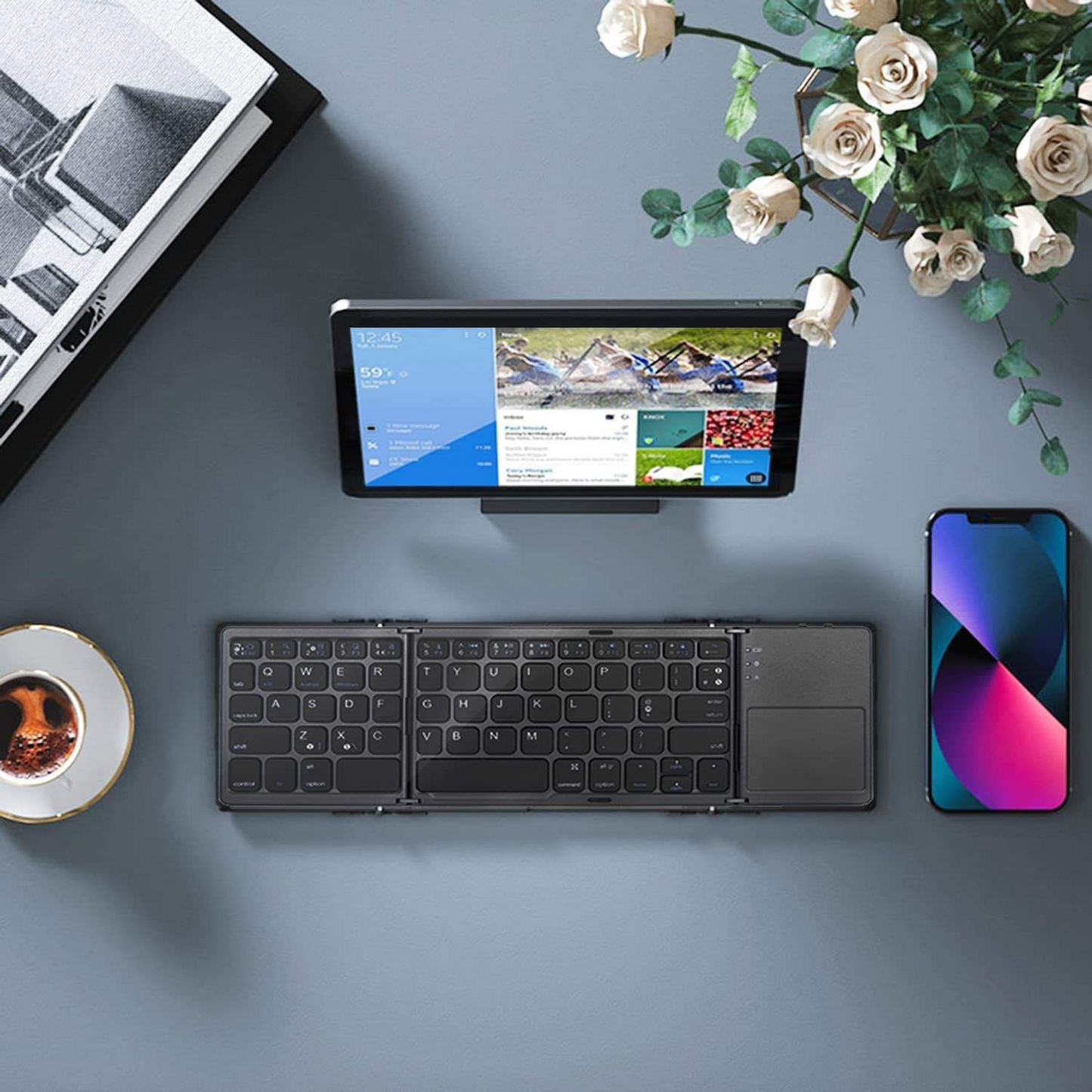 Tri-fold ultra-thin wireless Bluetooth keyboard for iPad, portable for business and office use, with touchpad.